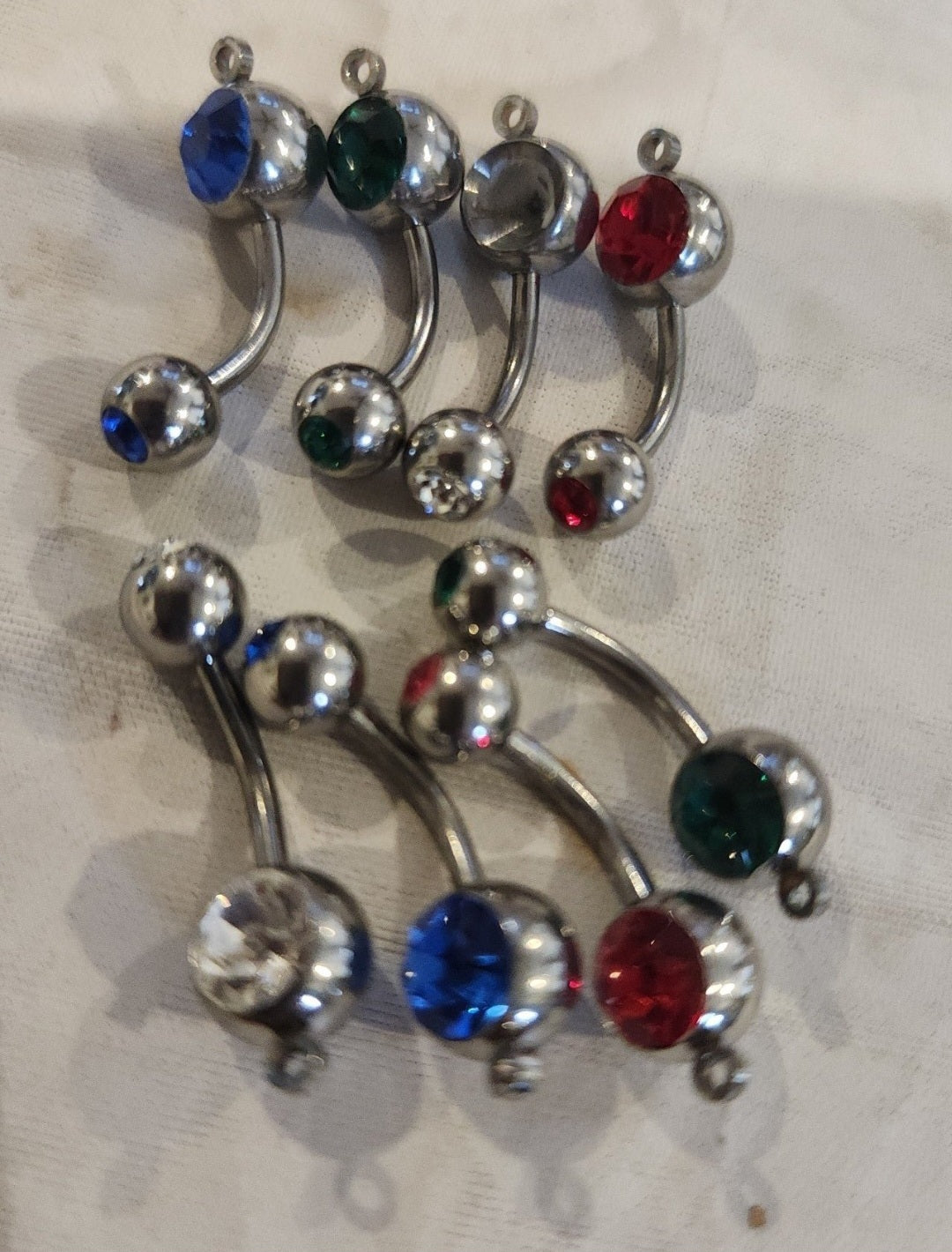 Sparkling Lot of 8 Double Jewel Belly button Rings 2 Faux Diamond, 2 firey reds 2 vibrant blues, 2 emerald greens.