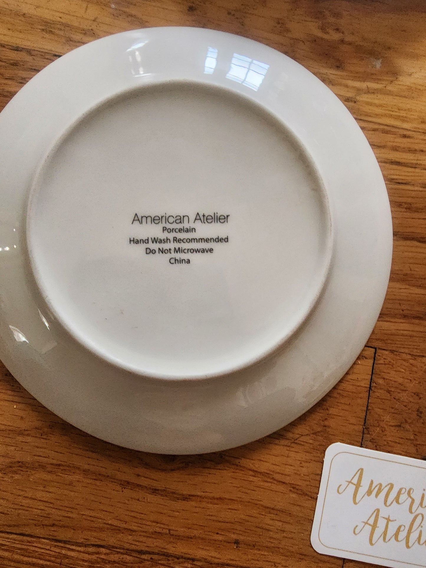 Four American Atelier holiday-themed dessert plates. Christmas