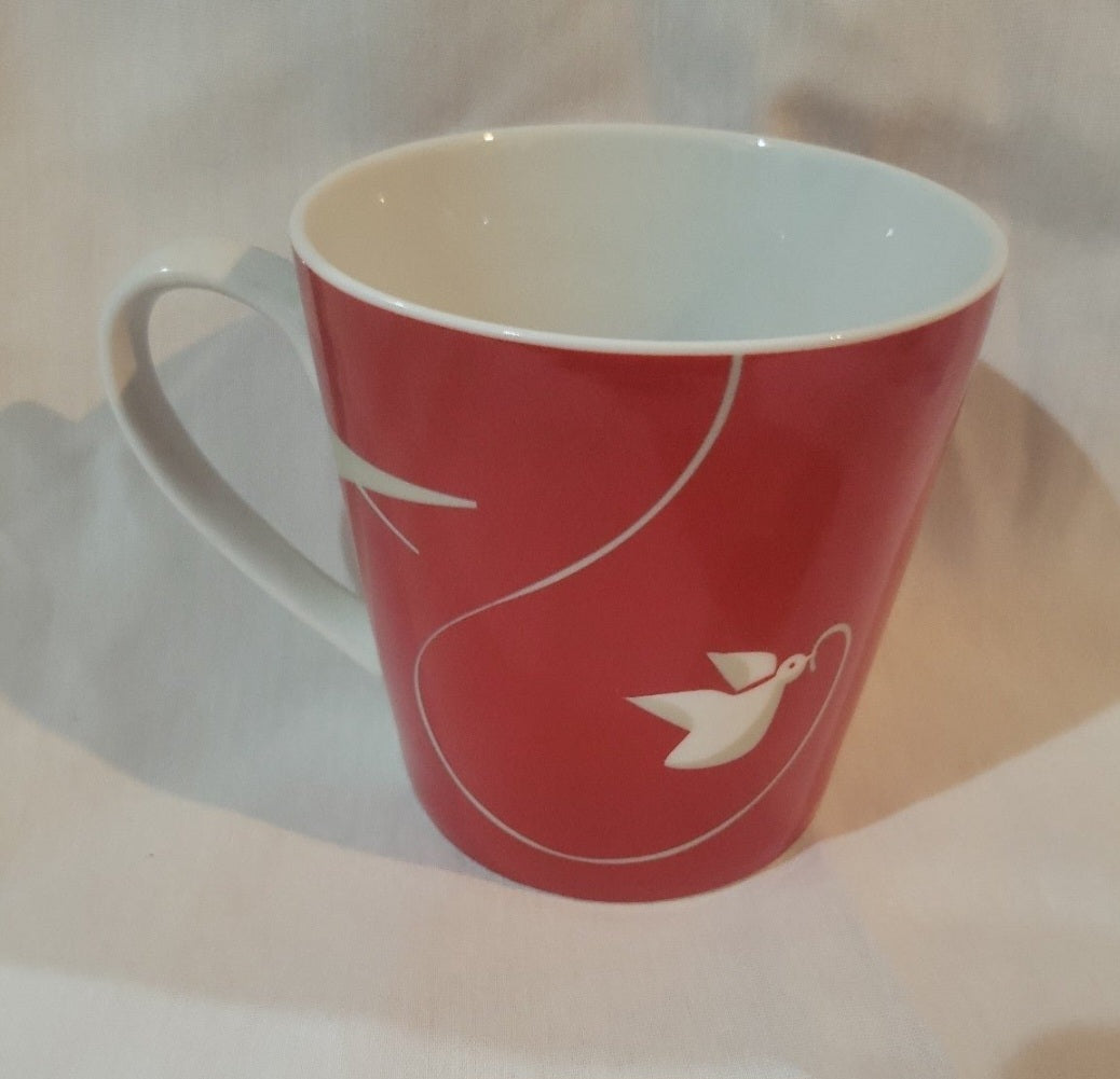 2011 Starbucks Red coffee mug. With Birds like new