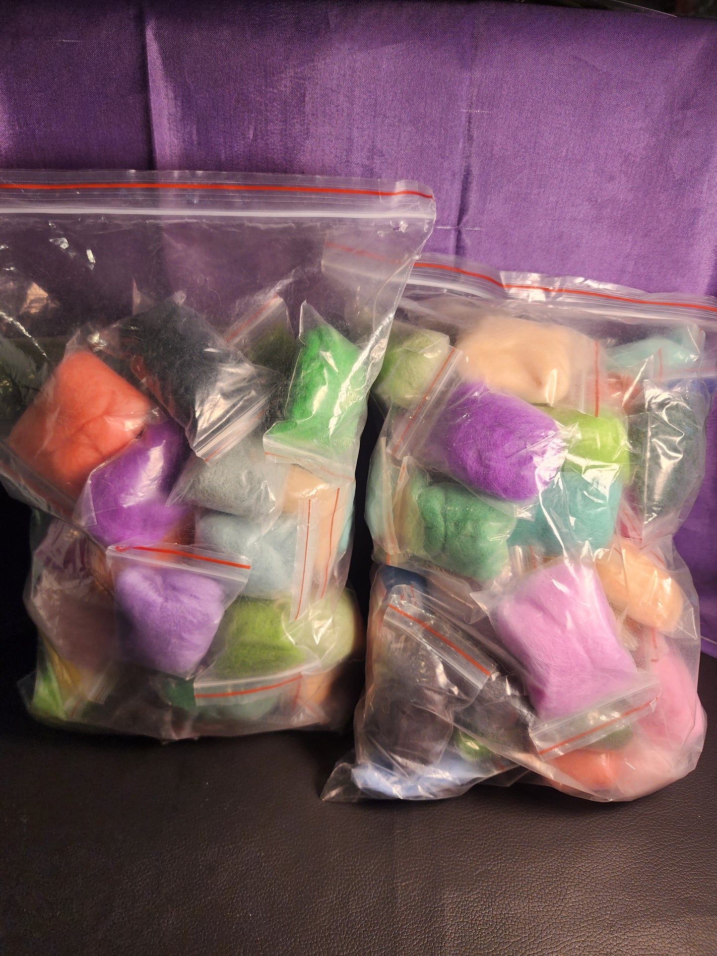 98 small pouches of assorted felting wool for crafts
