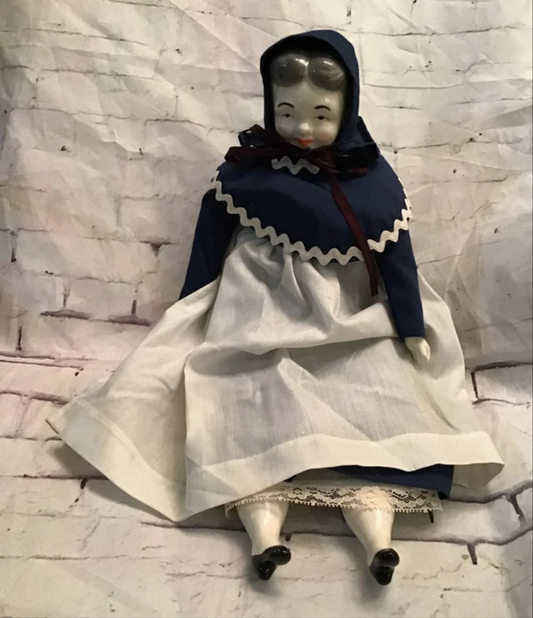 Vintage Porcelain Pilgrim doll. 16"