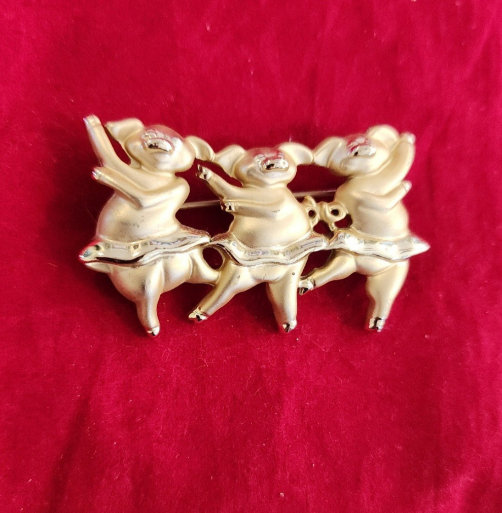 "Whimsical Dancing Pigs Pin! This charming gold-tone brooch