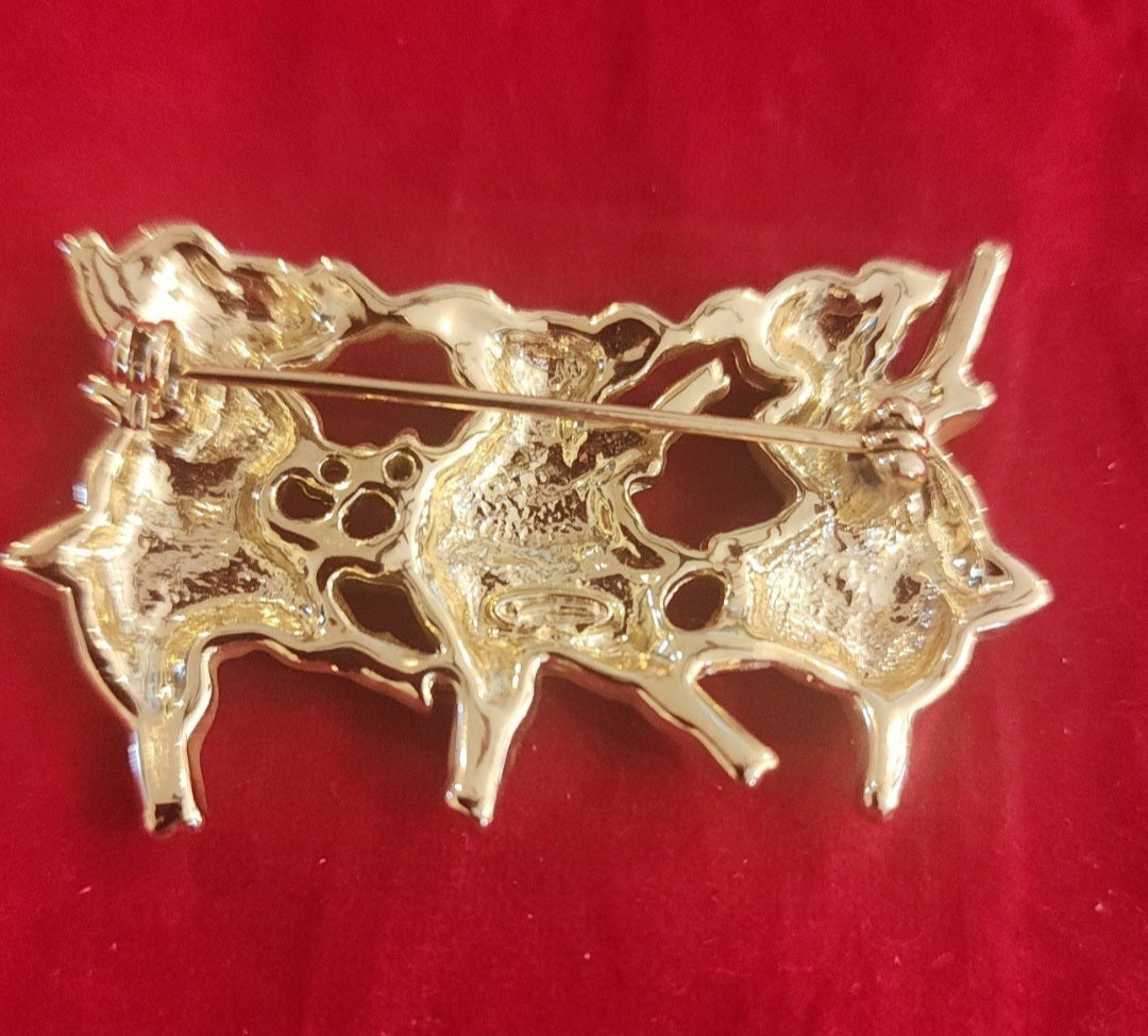 "Whimsical Dancing Pigs Pin! This charming gold-tone brooch