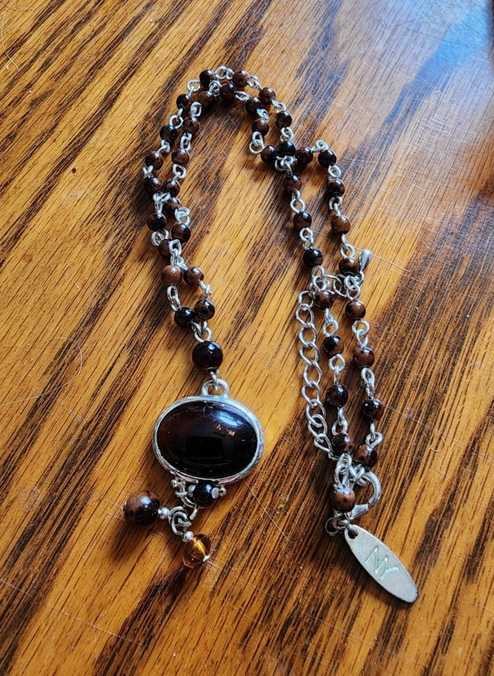 NY necklace with gold tone Accents and brown Beads