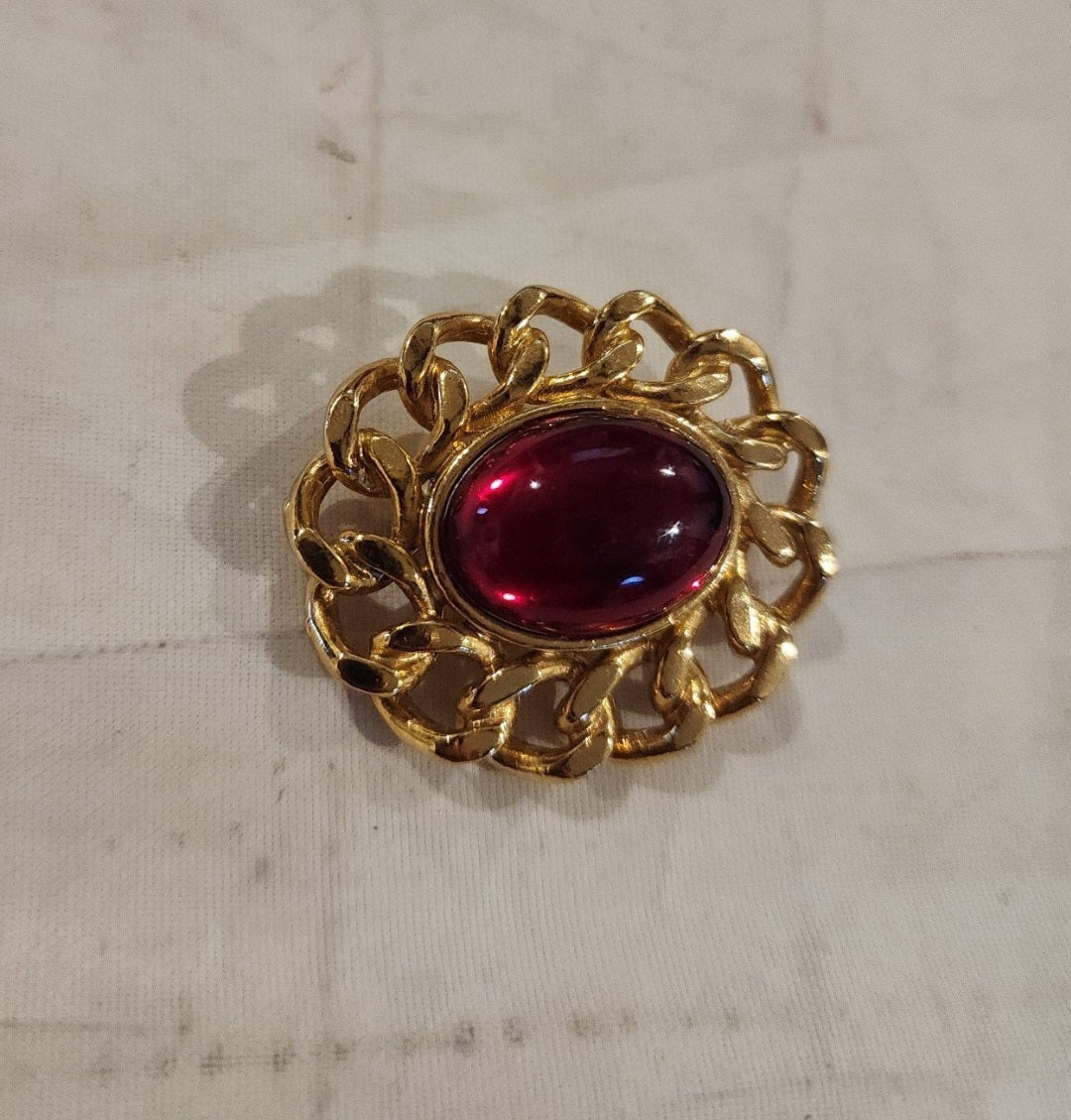 Vintage Unsigned Red Dome Brooch encased in a Gold tone setting.