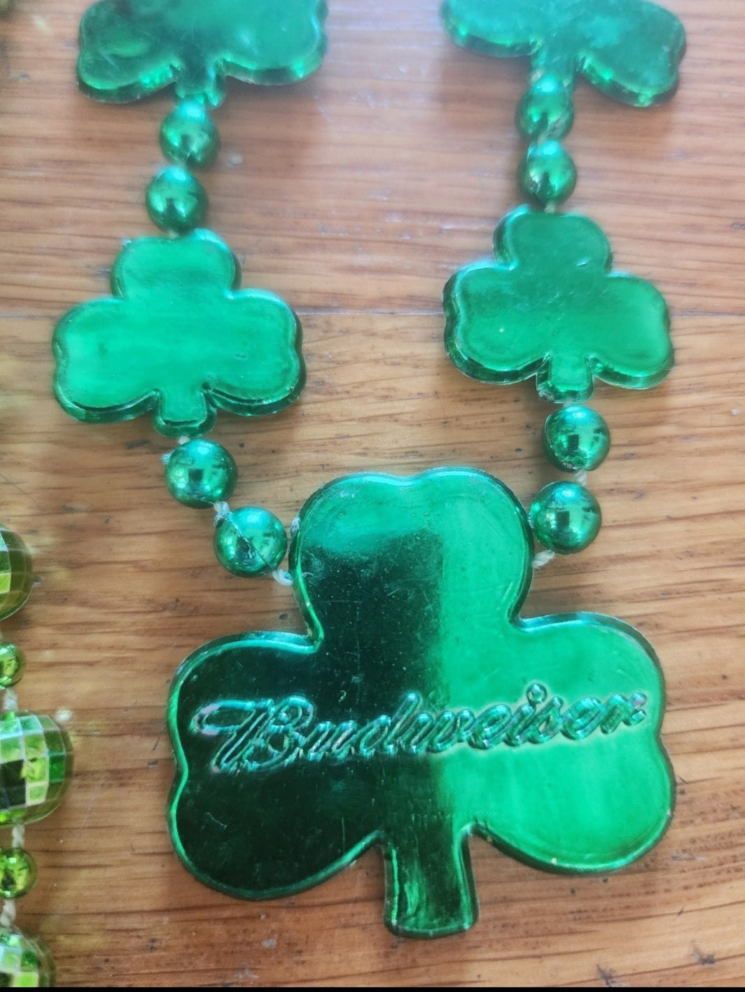 2 Green Mardi Gras Beads one Shamrocks says Budweiser and disco balls