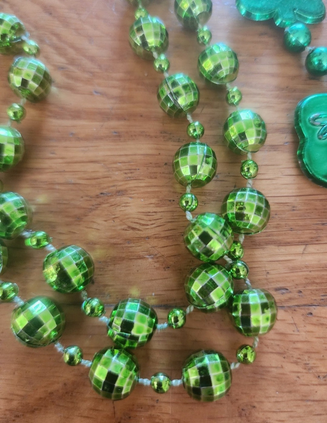 2 Green Mardi Gras Beads one Shamrocks says Budweiser and disco balls