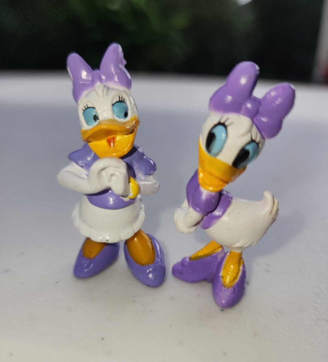 2 Adorable Disney Daisy Duck Figurines in purple made of pvc