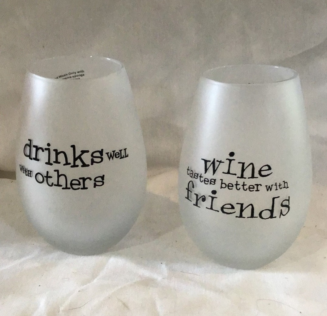 Two  Frosty wine glasses Drinks well with Others, wine taste better with friends