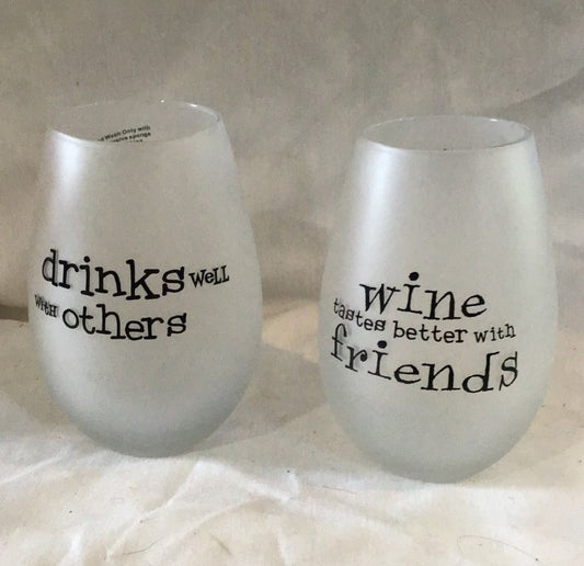 Two  Frosty wine glasses Drinks well with Others, wine taste better with friends