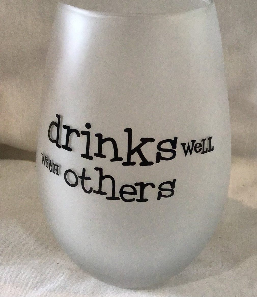 Two  Frosty wine glasses Drinks well with Others, wine taste better with friends