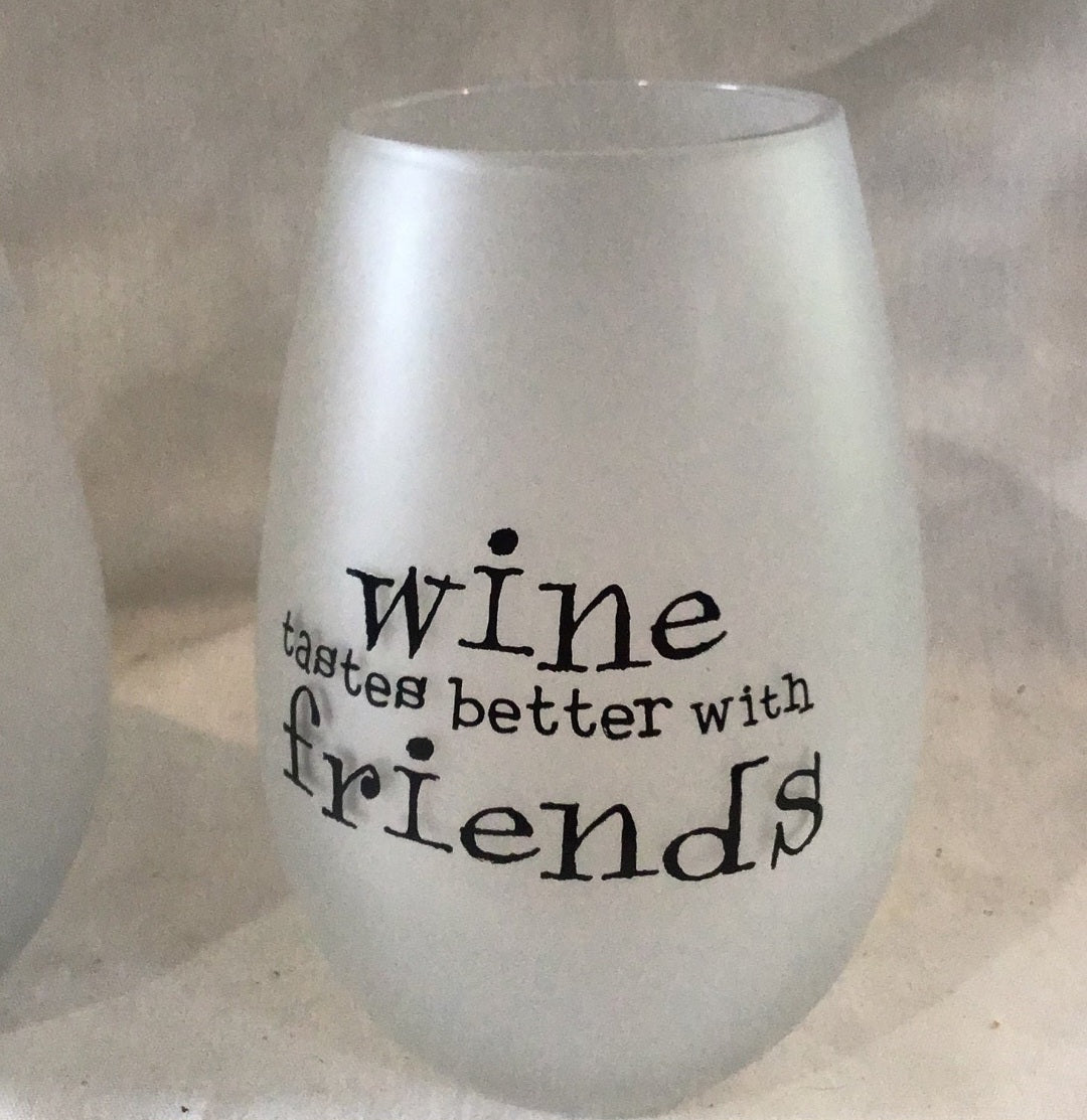 Two  Frosty wine glasses Drinks well with Others, wine taste better with friends