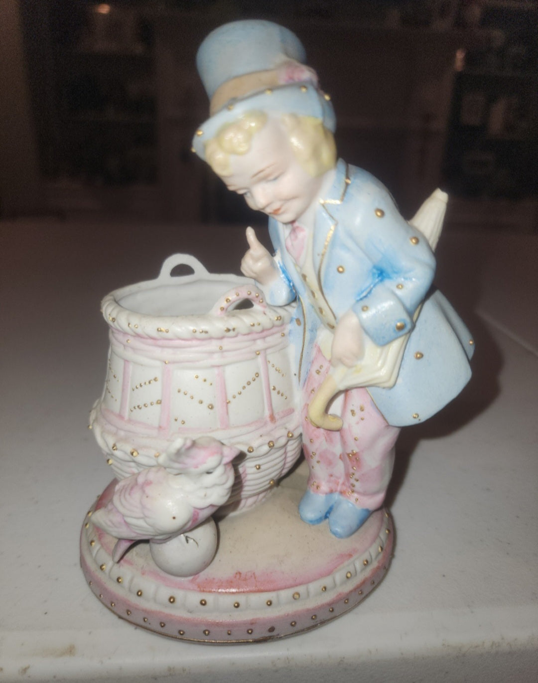 Occupied Japan Paul Ux Victorian Boy w Cockatoo and basket in pink blue and Gold