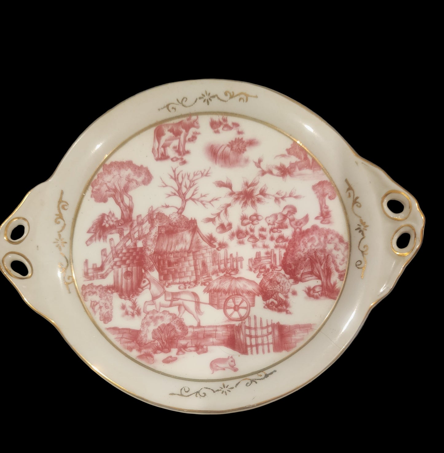 Miniature porcelain Tea Set with a pink toile or chintz pattern and gold gilt