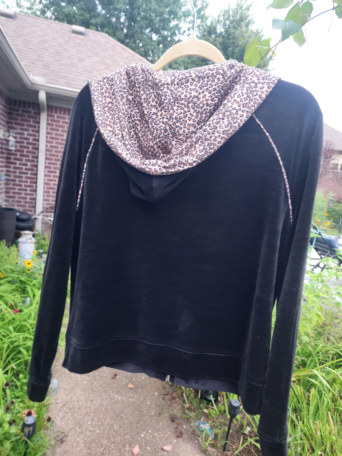 Classic black with a fun, eye-catching leopard print hood and pocket trim.