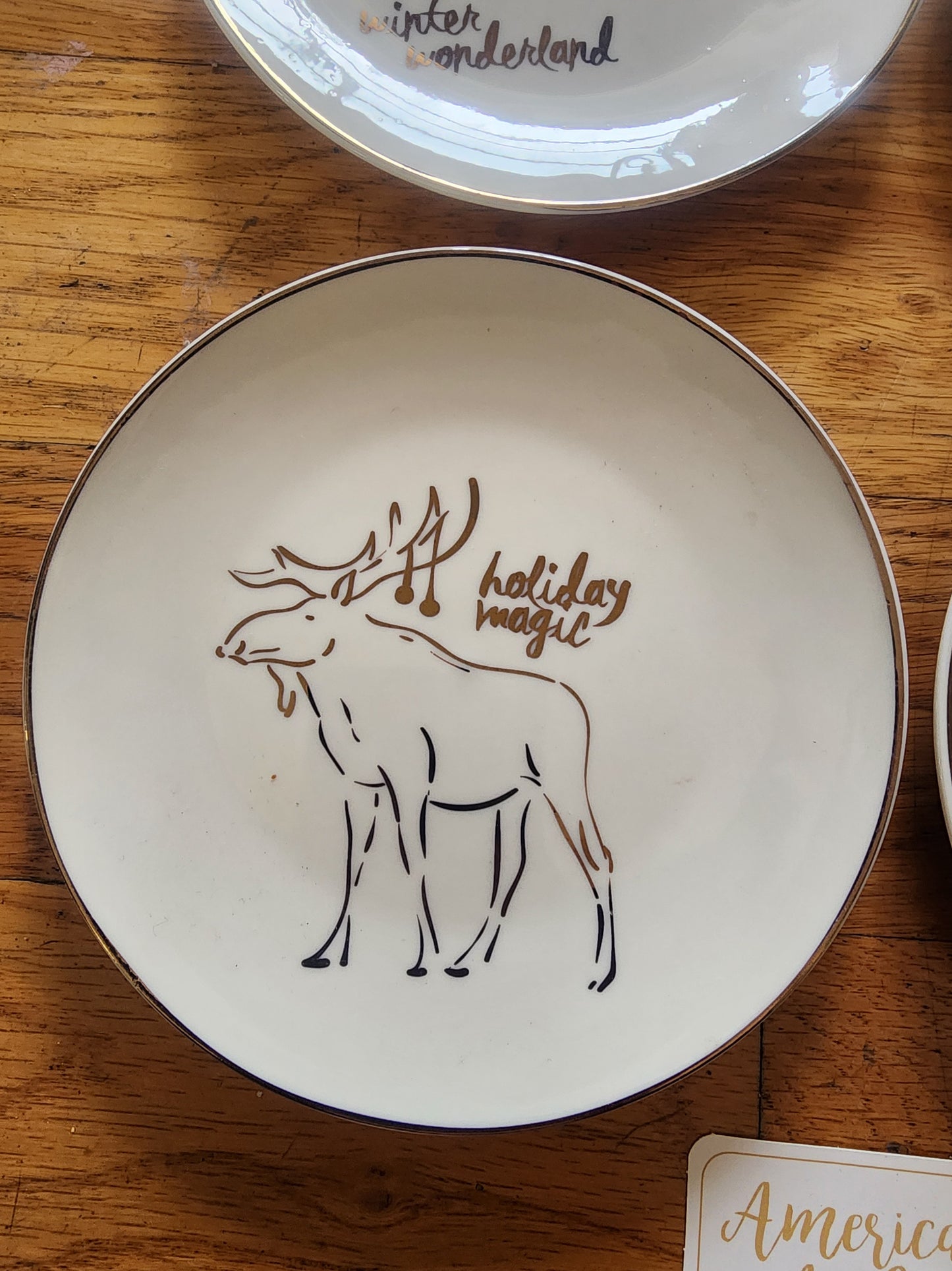 Four American Atelier holiday-themed dessert plates. Christmas