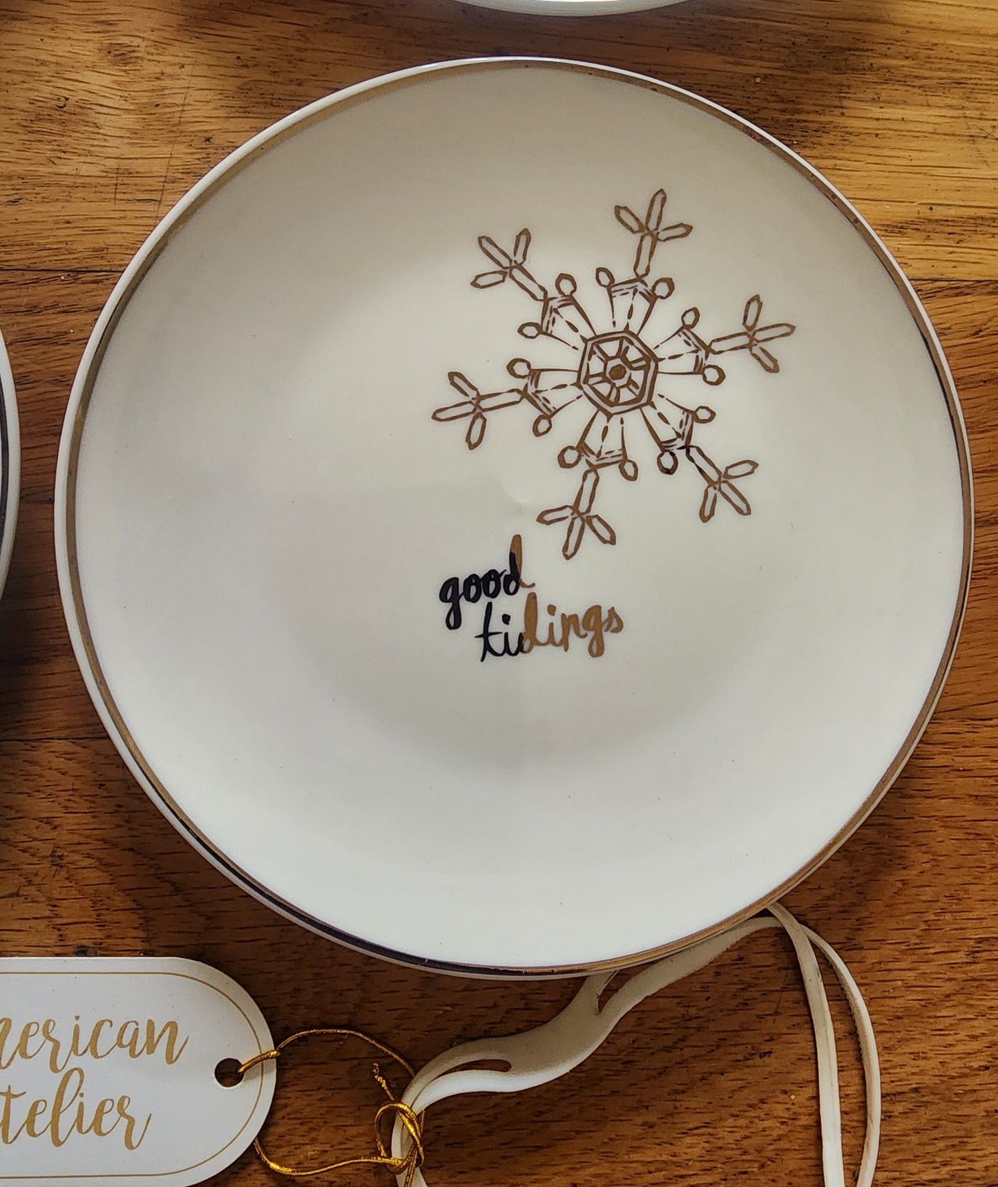 Four American Atelier holiday-themed dessert plates. Christmas