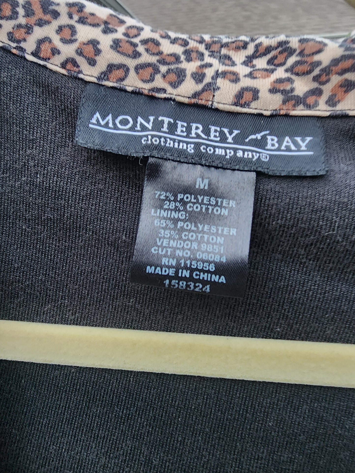 Classic black with a fun, eye-catching leopard print hood and pocket trim.