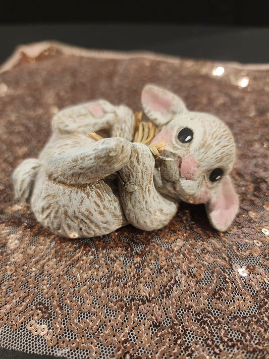 Cute Ceramic Rabbit laying playfully on back just in time for Easter