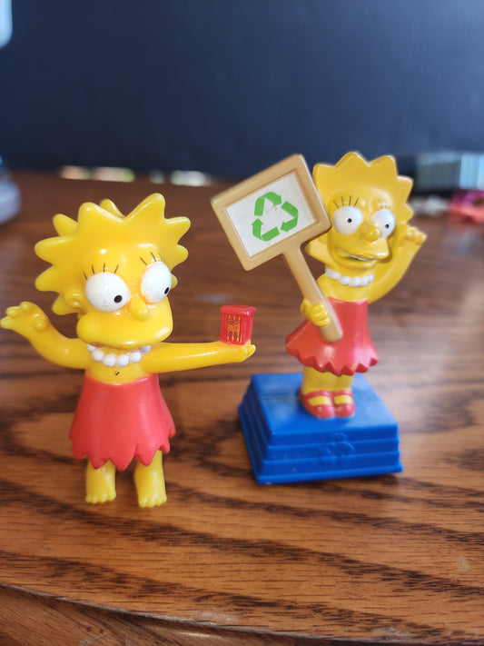 The Simpsons Movie Burger King Toy Lisa Recycle 2007
2 figures in good condition. No longer talks.