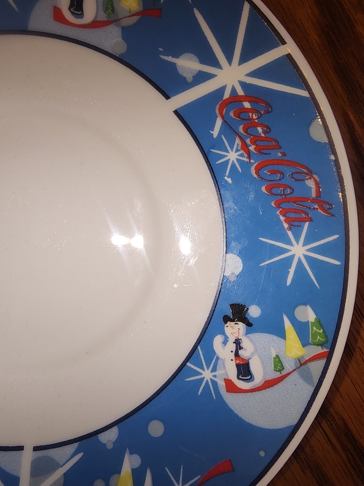 The Coca Cola Company Laughing Snowman.  2 Saucers.  Blue, red, white.
