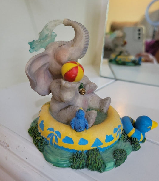 Elephant Having a Ball figurine sitting in a pool. By Hamilton Collection Peanut