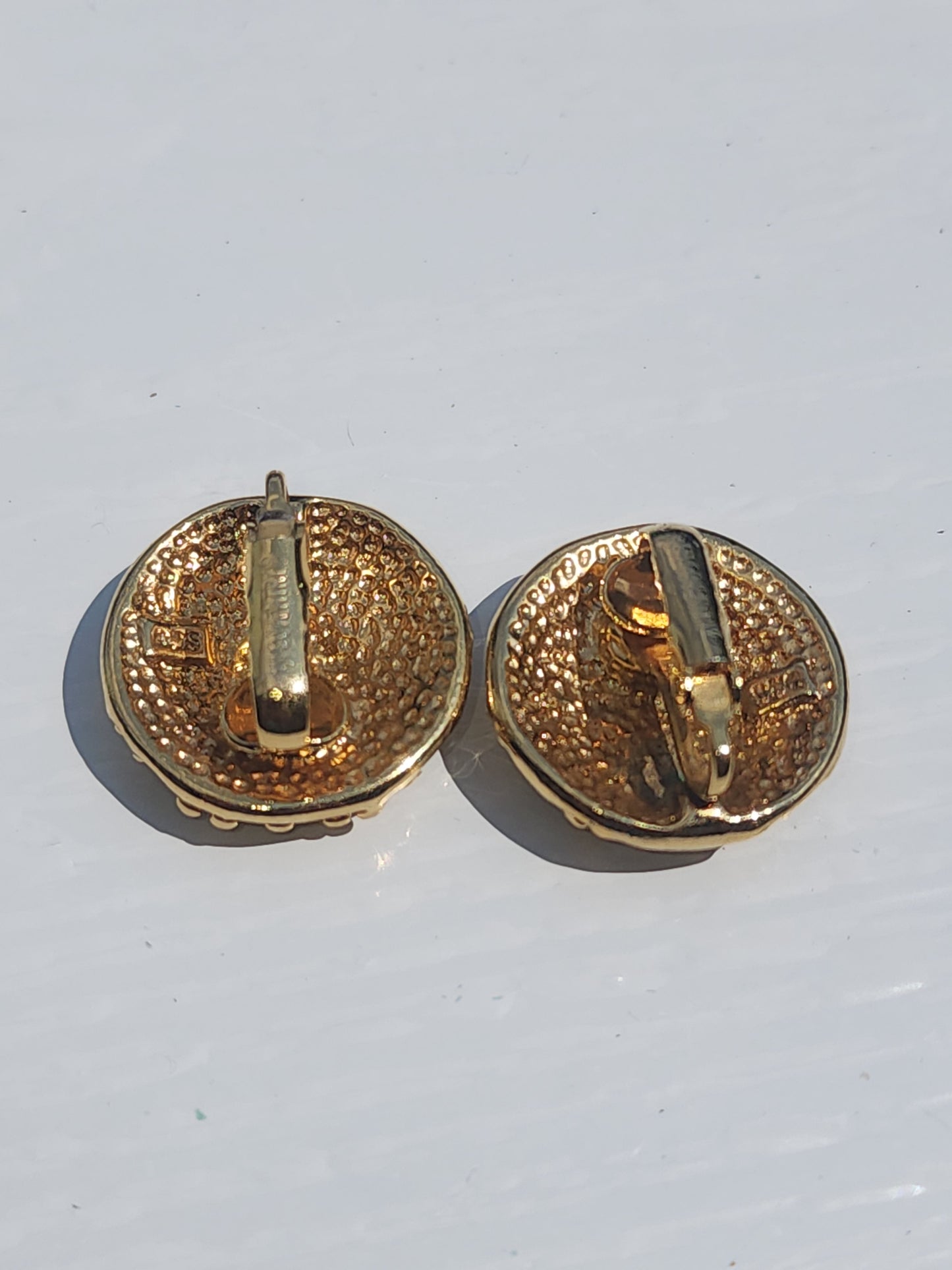 Vintage Sarah Coventry Gold Tone Textured Clip-On Earrings. Button style with a unique nugget texture. Excellent condition."