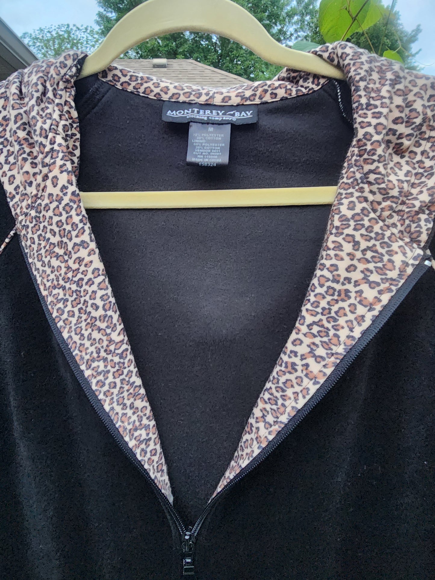 Classic black with a fun, eye-catching leopard print hood and pocket trim.