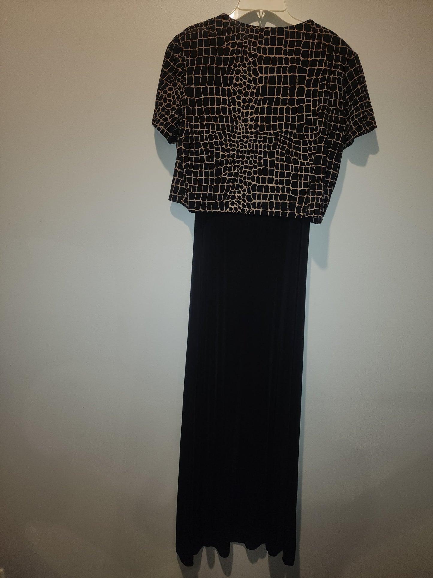 Black maxi dress paired with a short-sleeved top featuring a Giraffe Pattern M
