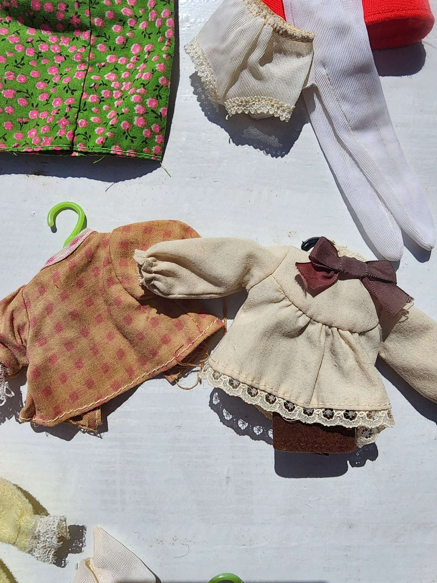 Small Vintage doll clothes aprox. 25 pieces with hangers