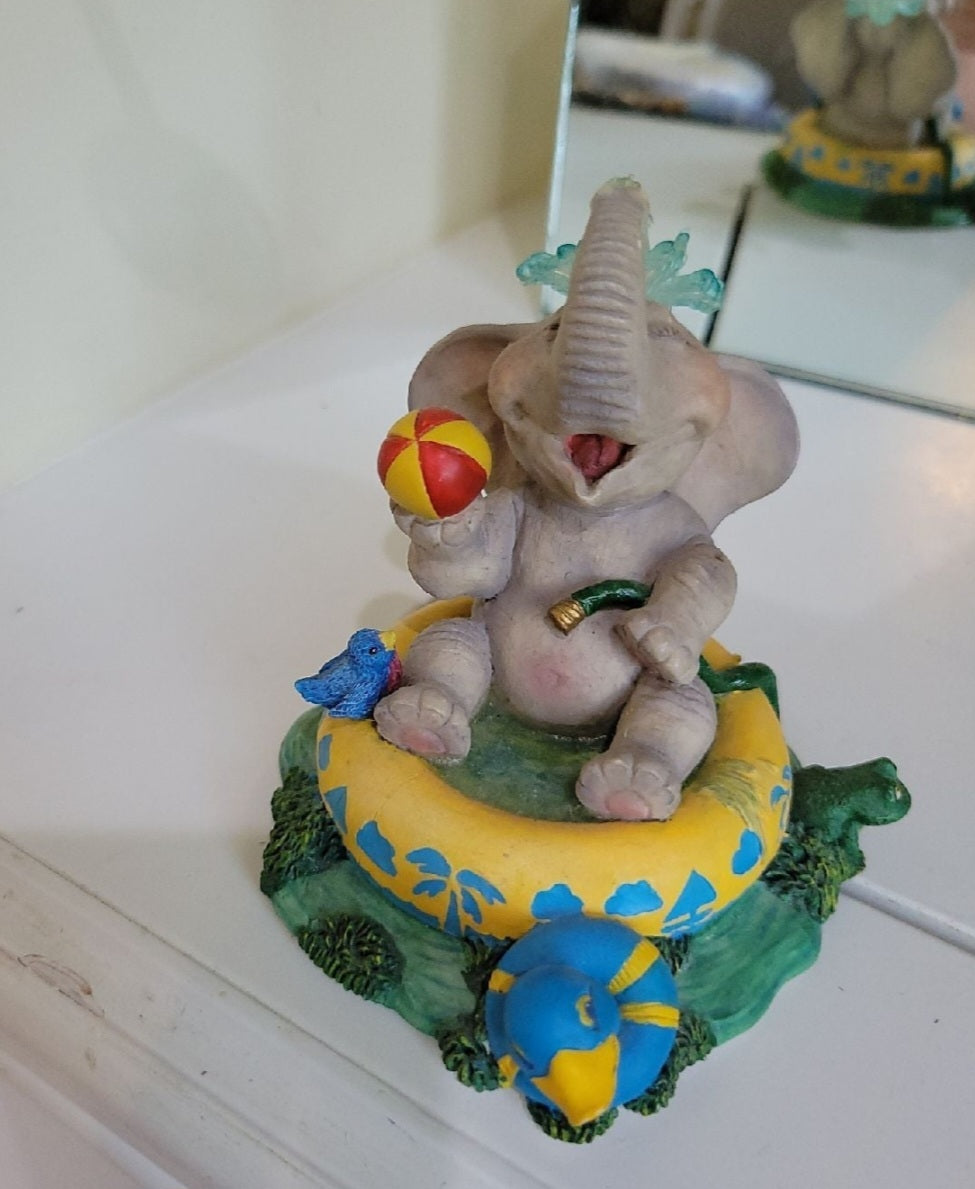 Elephant Having a Ball figurine sitting in a pool. By Hamilton Collection Peanut