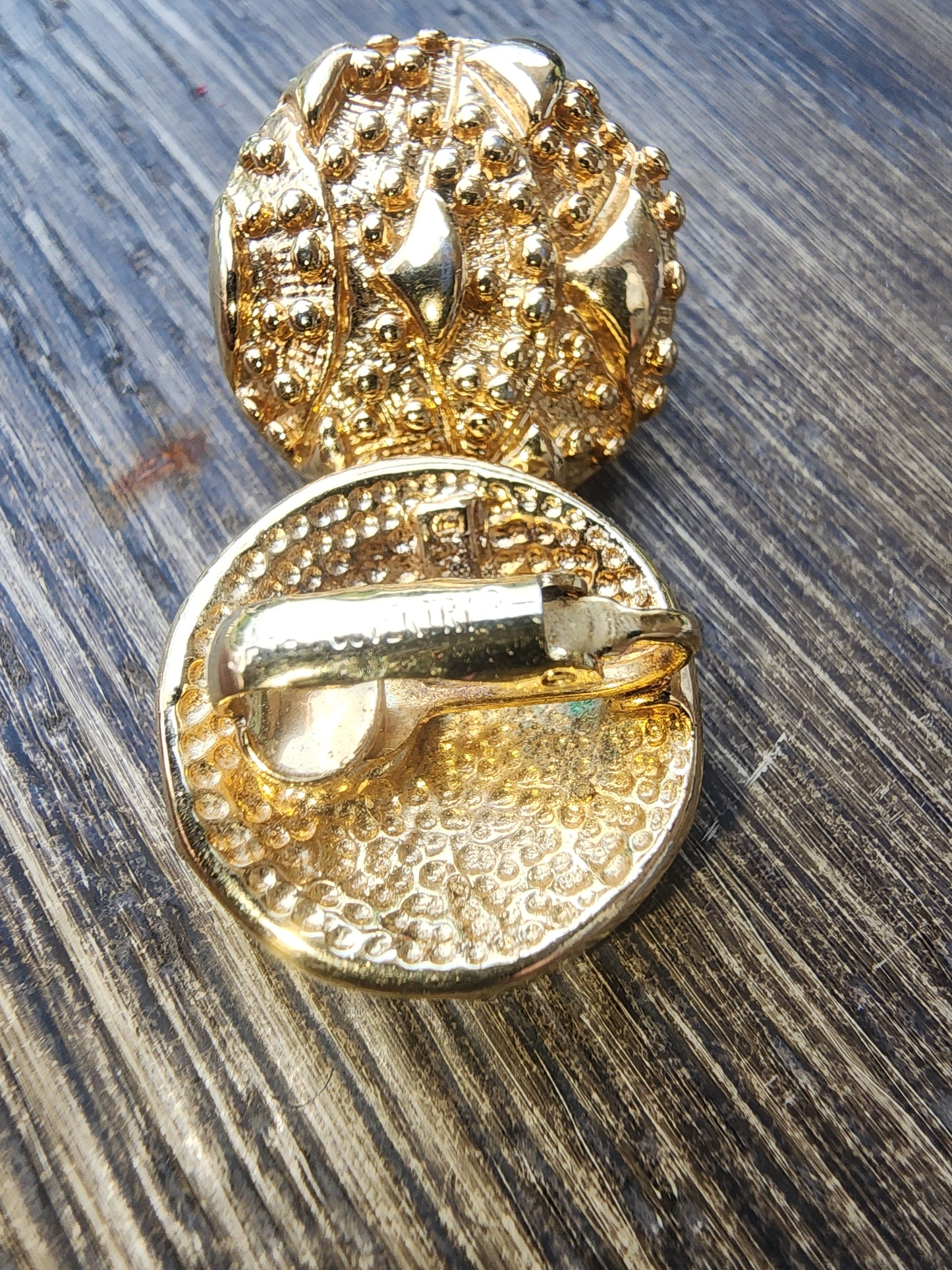 Vintage Sarah Coventry Gold Tone Textured Clip-On Earrings. Button style with a unique nugget texture. Excellent condition."