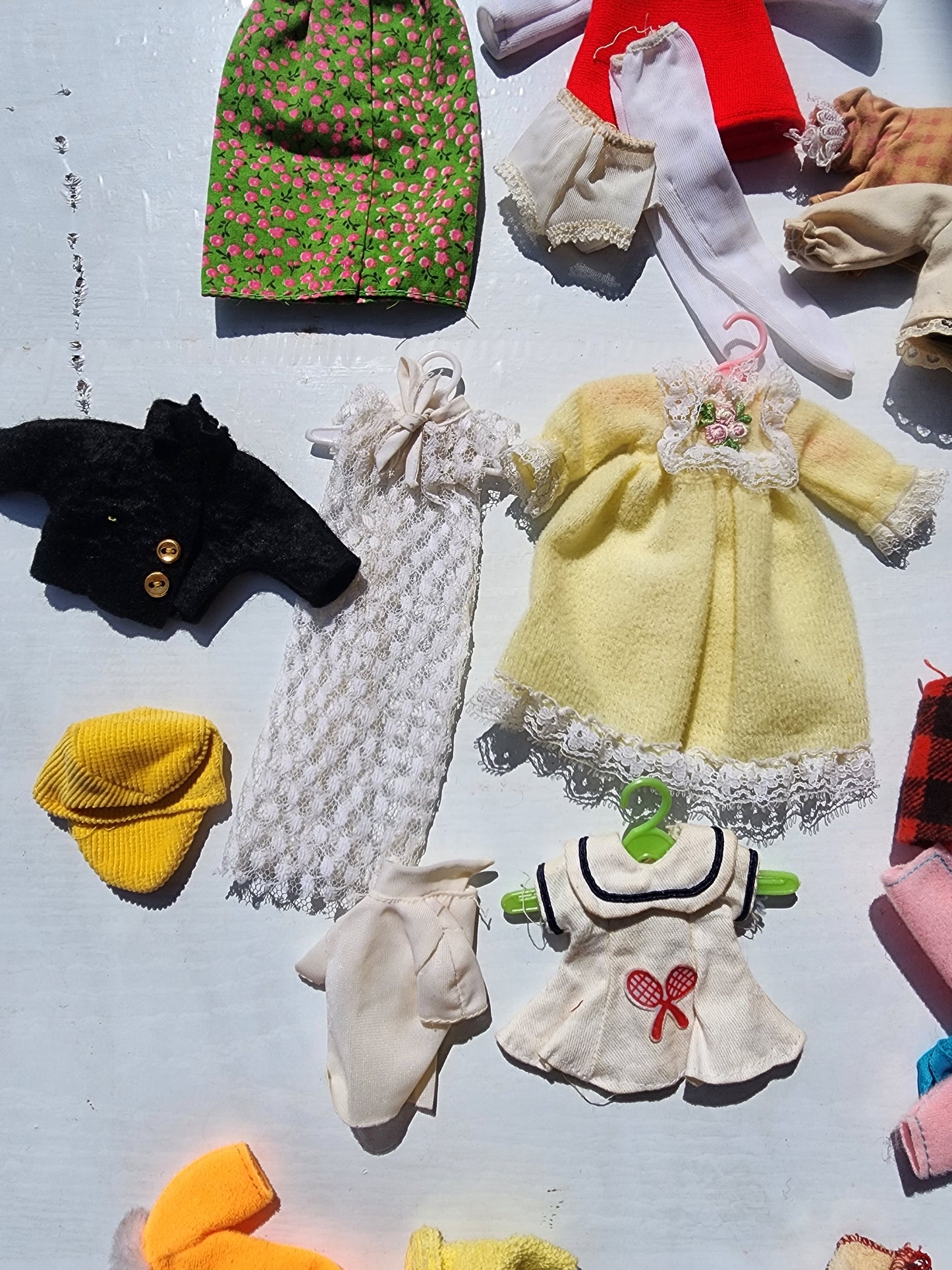 Small Vintage doll clothes aprox. 25 pieces with hangers