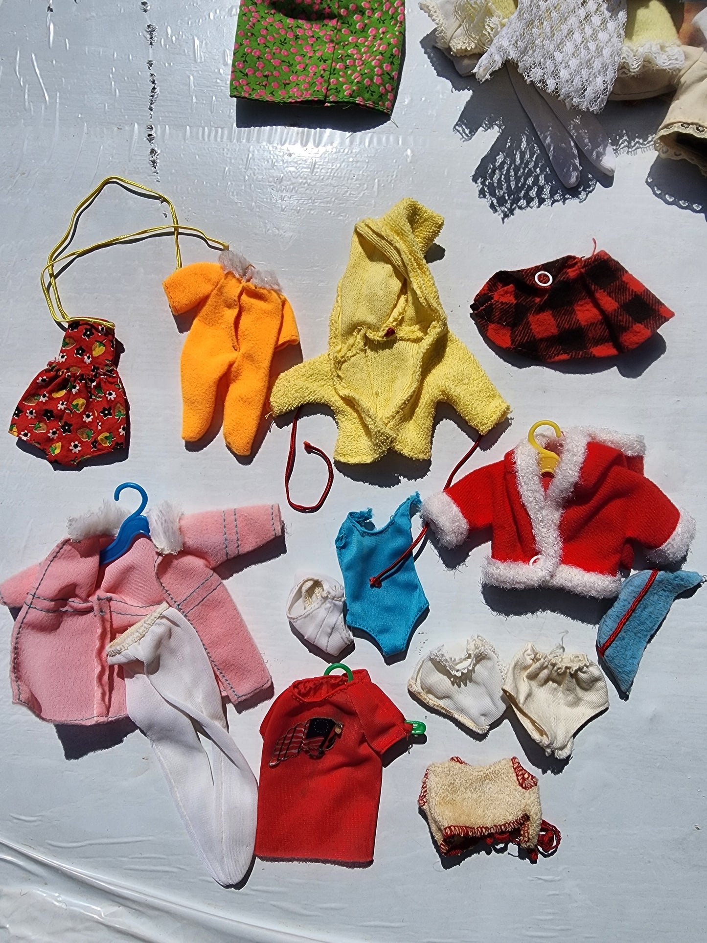 Small Vintage doll clothes aprox. 25 pieces with hangers