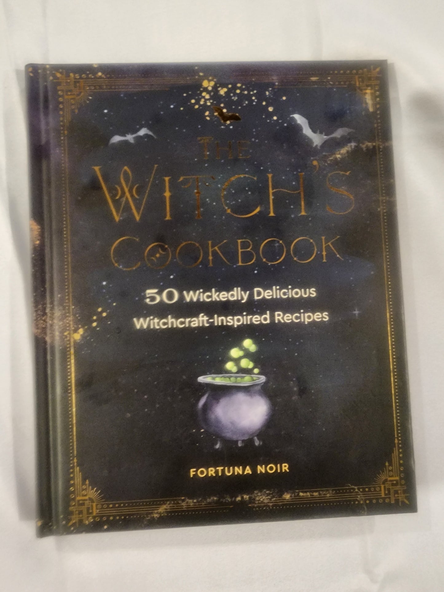 The Witch's Cookbook: 50 Wickedly Delicious Witchcraft-Inspired Recipes HB Book