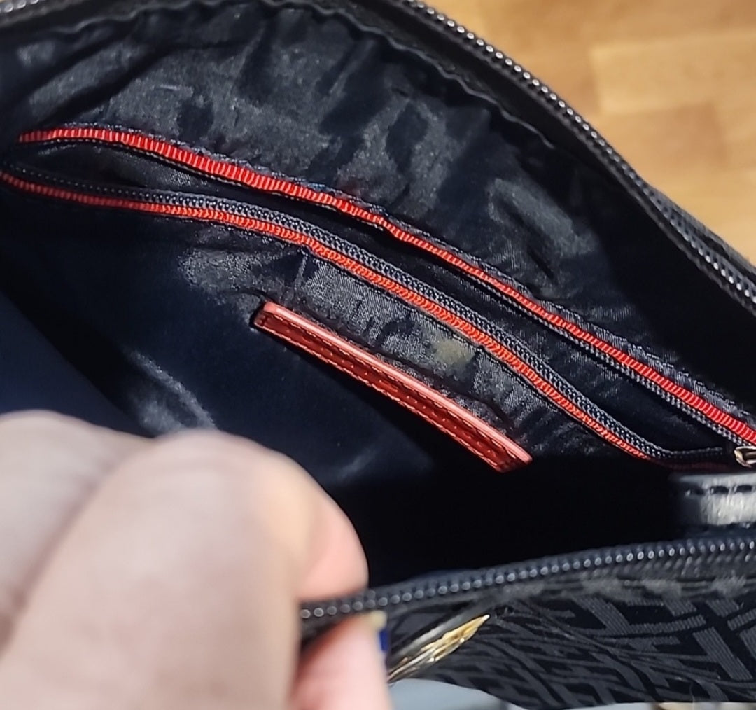 Tommy Hilfiger  black crossbody bag is perfect for any occasion.