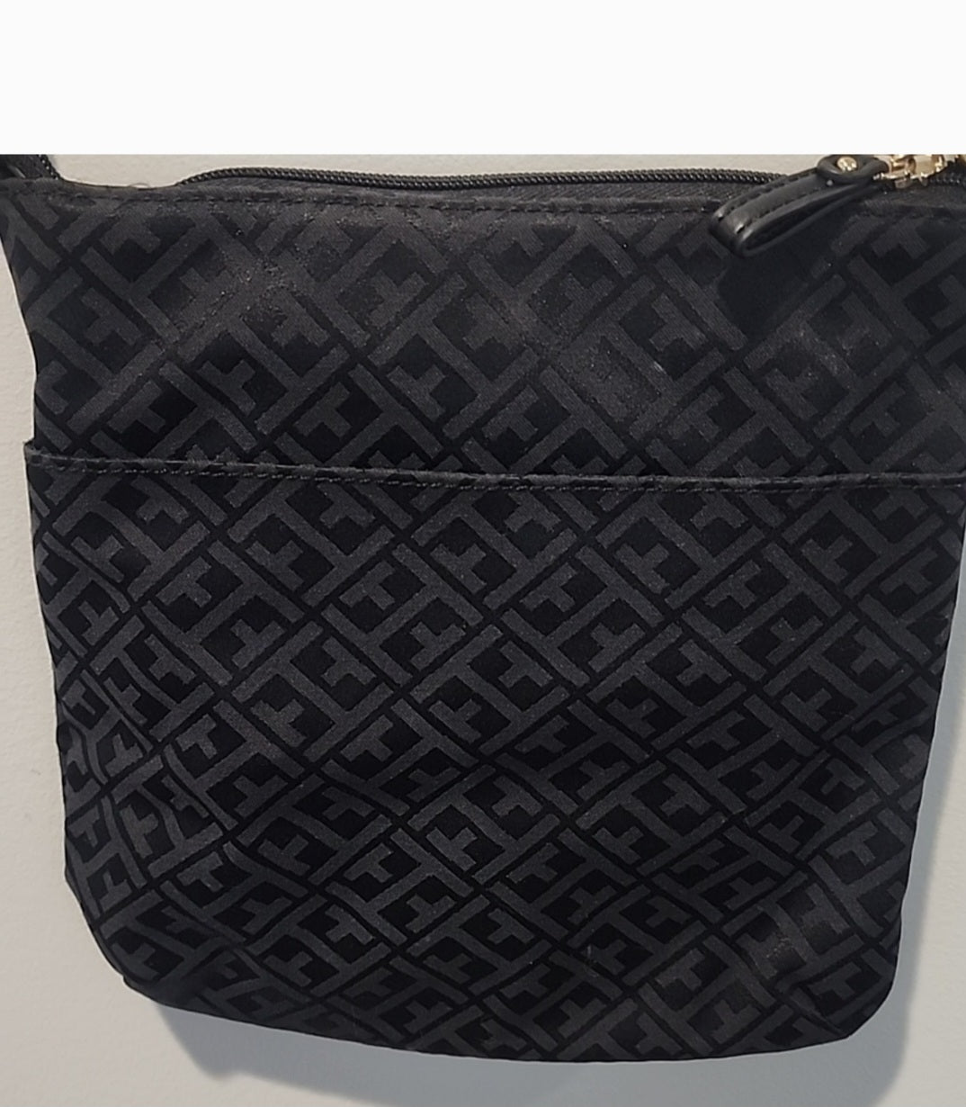 Tommy Hilfiger  black crossbody bag is perfect for any occasion.